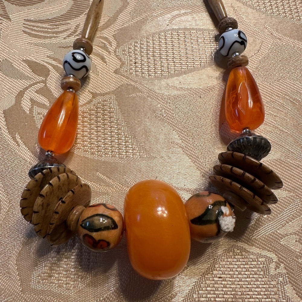 Orange Beaded Necklace with Unique Accents